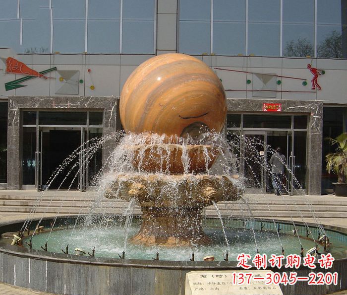 郴州石来运转球晚霞红风水球石雕